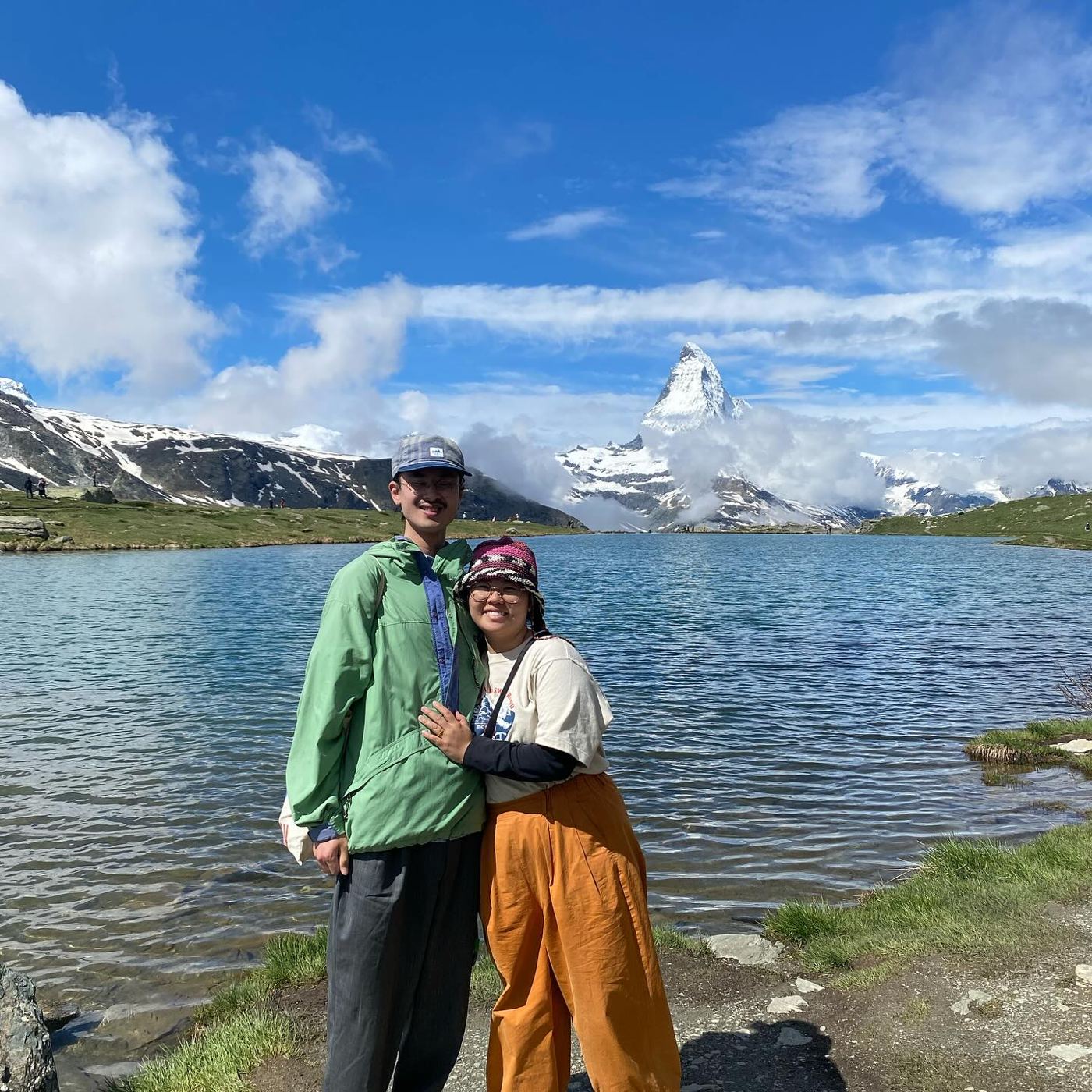 Ryo and Maria at a lake below the snow-capped Matterhorn