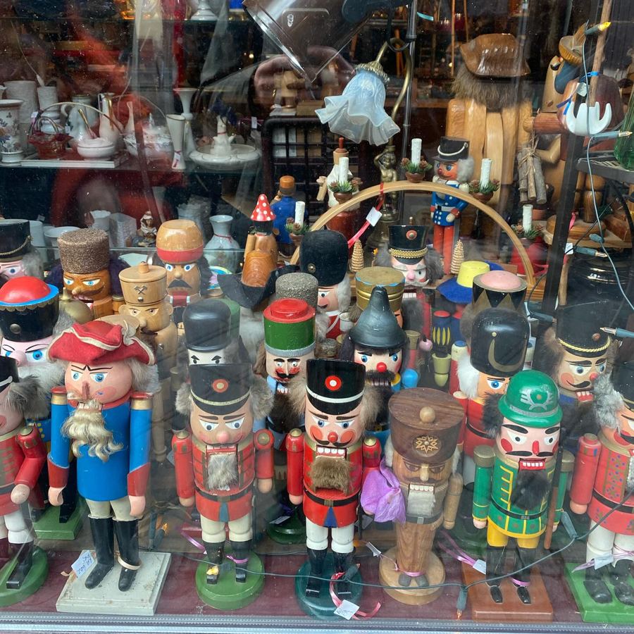 Rows of painted wooden nutcrackers in a shop window